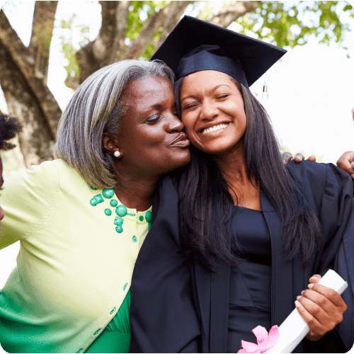 Mother and daughter embracing after graduation