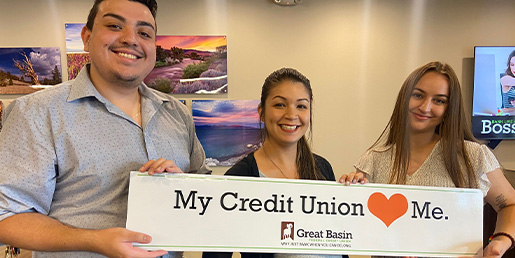 GBFCU employees holding a My credit union loves me sign